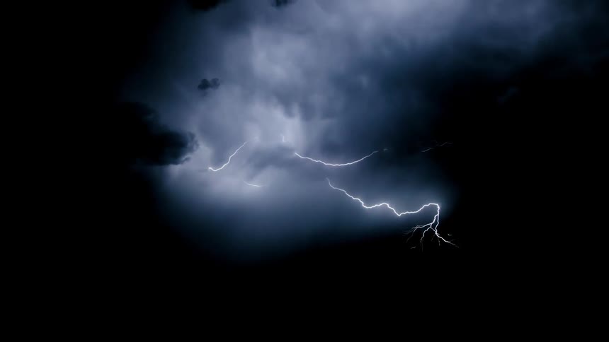 Lightning flashes in the night sky