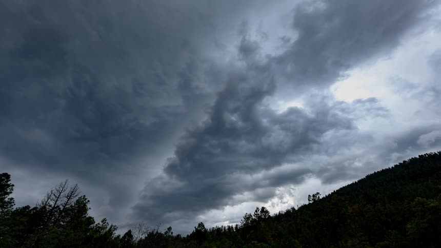 Clouds cross over a mountain
