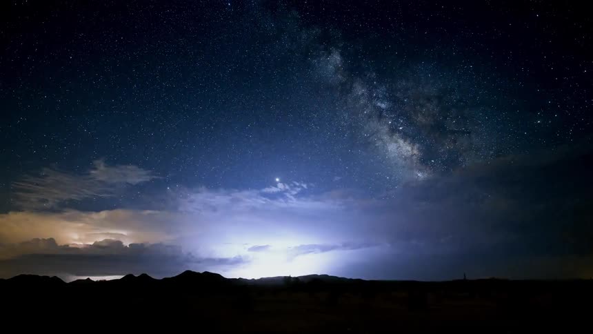 Storm clouds flashing at night