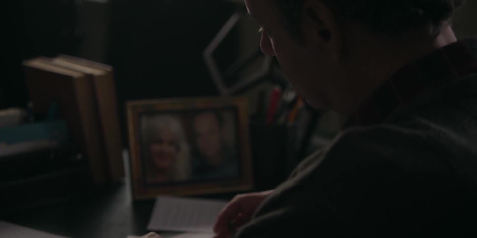 A man i s  writing a letter