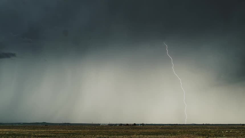 Streaks of lightning flash in the cloudy sky