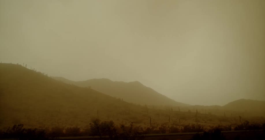 Lightning flashes behind the mountains