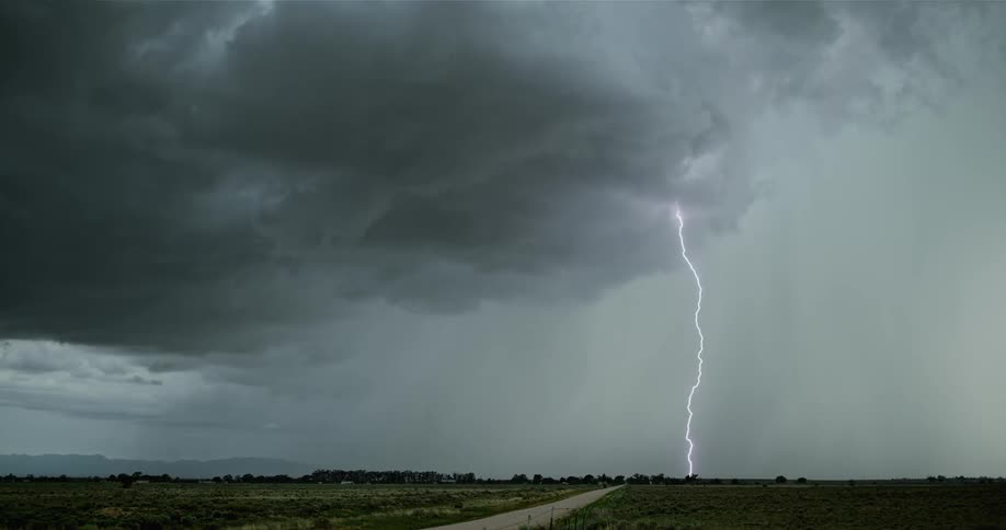 Lightning streaks across dark cloudy sky