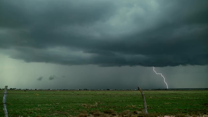 The rain is pouring and lightning is flaring in the storm ahead