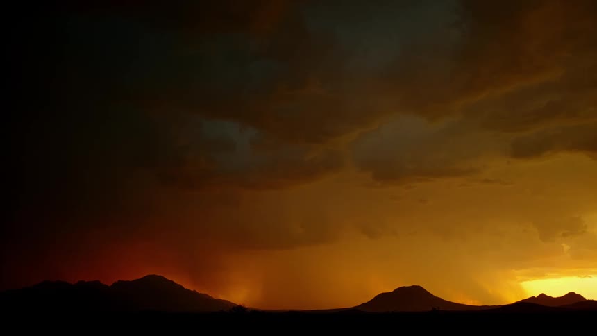 Lightning bolts flash across the sky over peaks