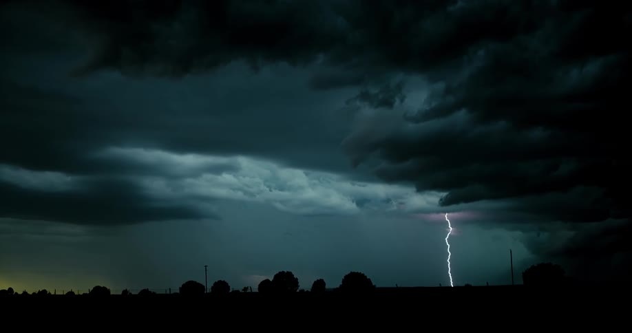 The lightning is flashing hitting the ground below