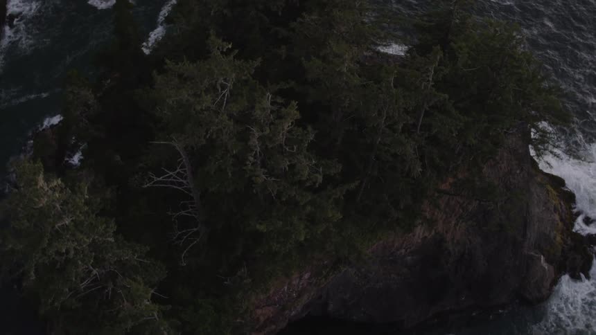 Ocean waves crash into the shoreline