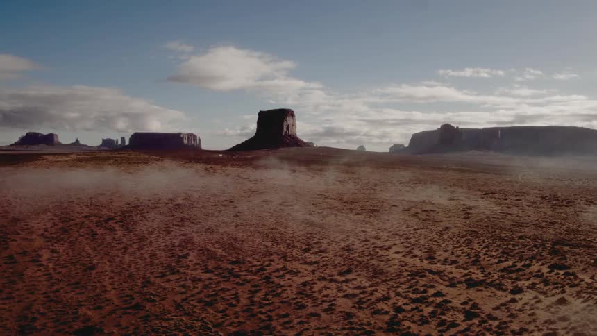 Cloud float over a desert landscape
