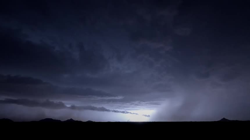 The lightning flashes fast lighting the clouds up