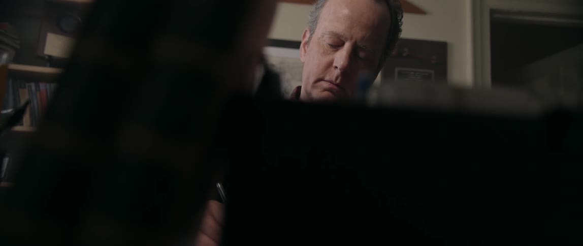 Man sitting down and writing