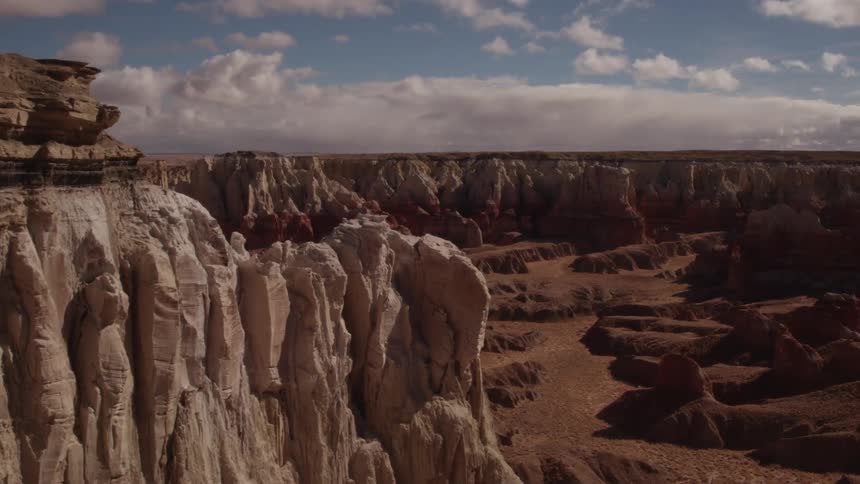 The canyon is steep and full of stone and sand