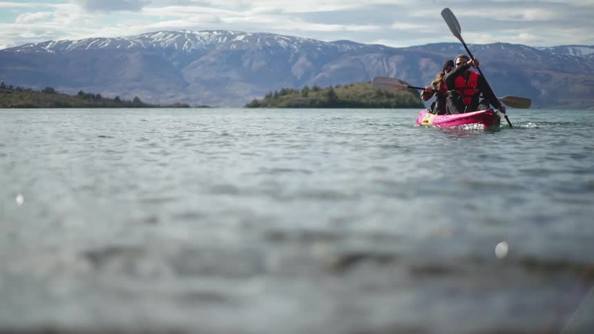 Men paddle in a canoe