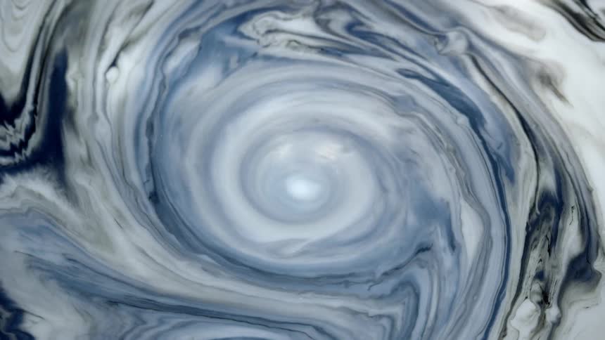White liquid swirls around in a circle