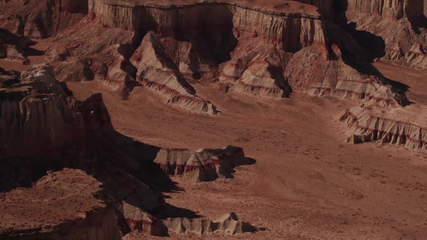 Passing over canyon rock formations and red dirt