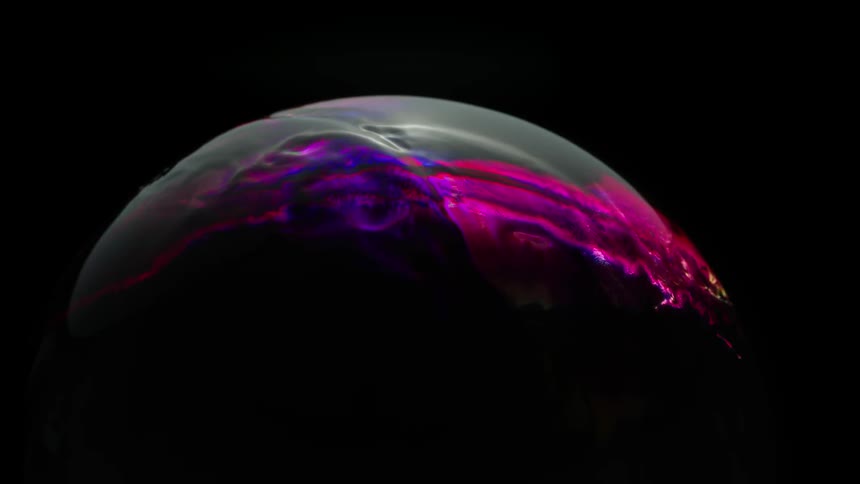 Colored liquid spreads over a circular object