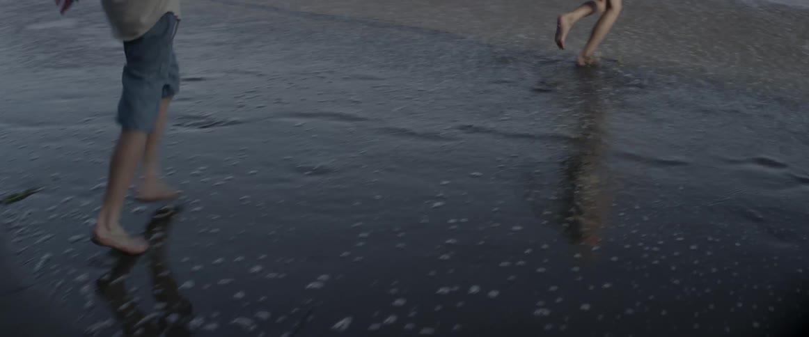 People run and play on the beach