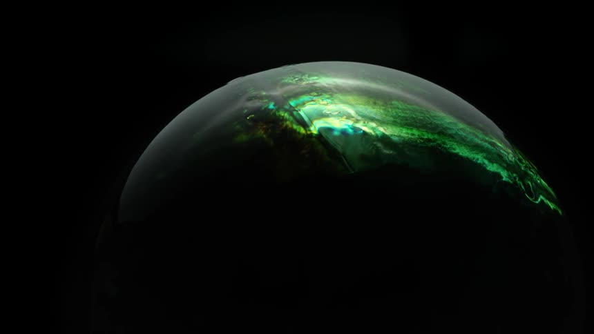 Colored liquid spreads over a circular object