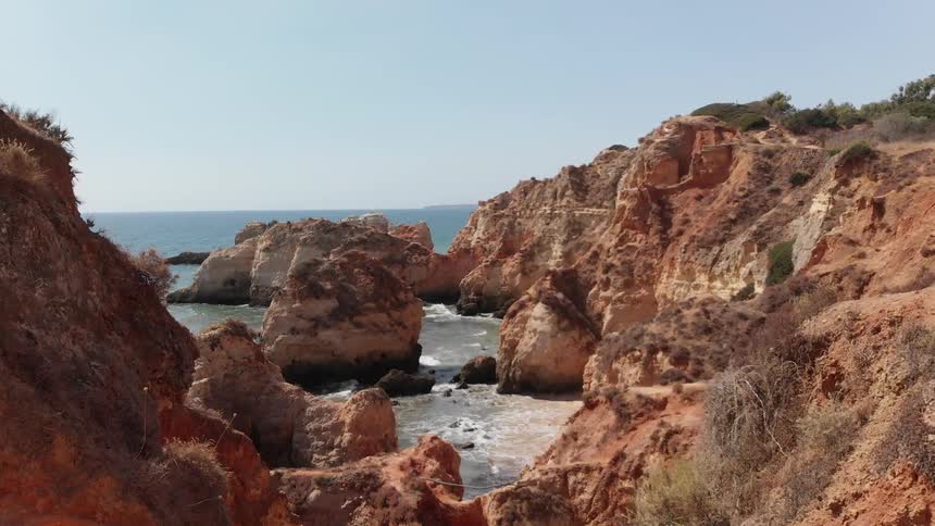 The tall cliffs line the beach ahead