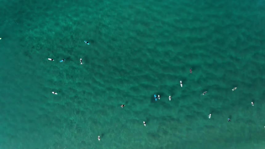 Canoes float in the blue ocean