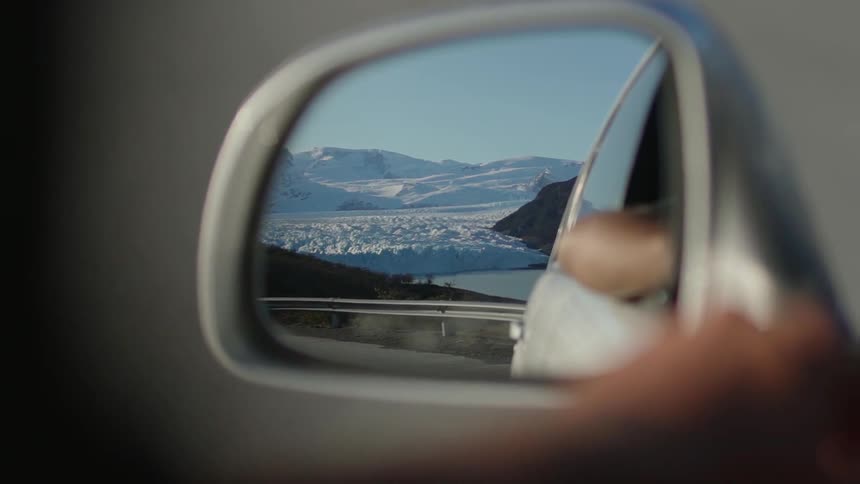 A car drives in snowy mountains