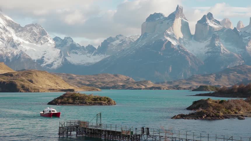 A boat floats on a mountain lake