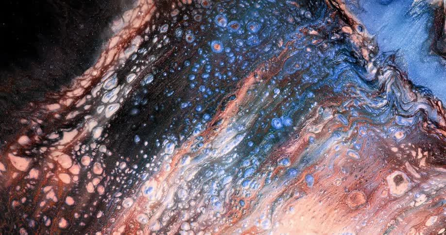 Paint is moving around in waves and creates organic cell patterns