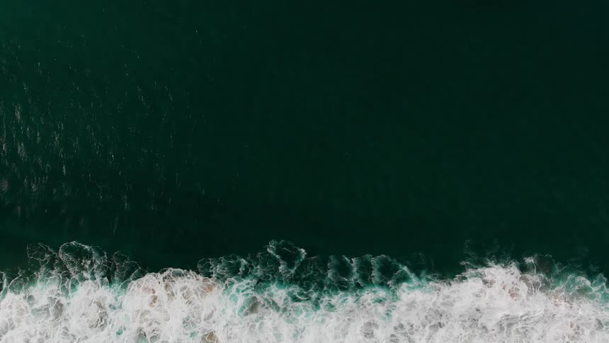 Ocean waves flow towards the shore