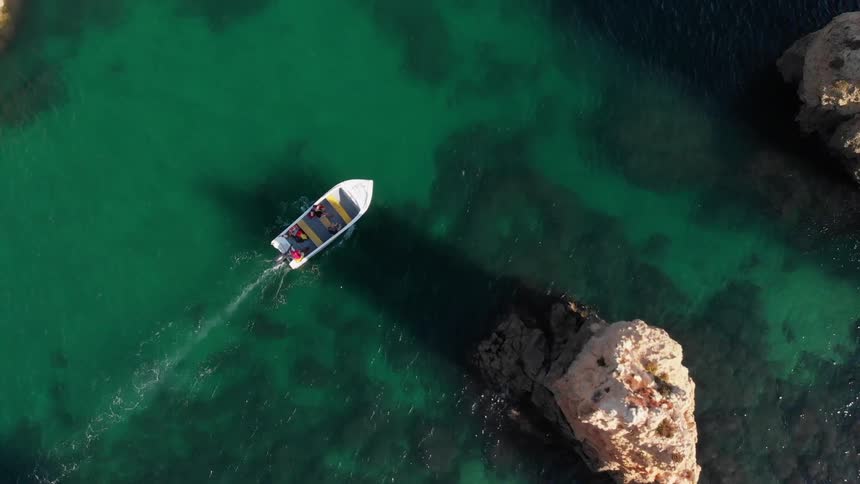 A boat floats on the ocean