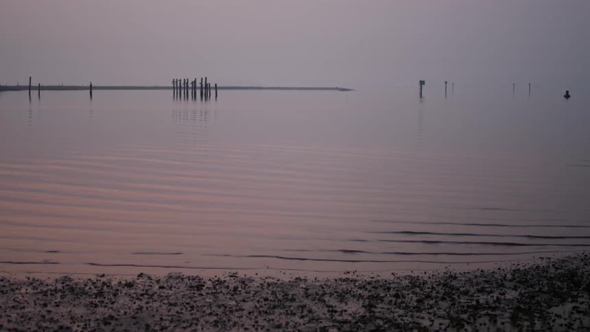 Small waves gently roll in to the beach