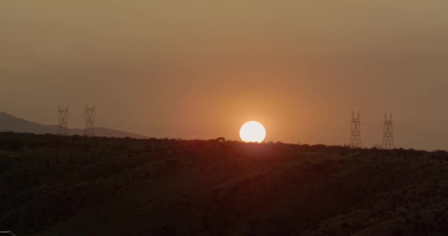 Sun rises over flat plains