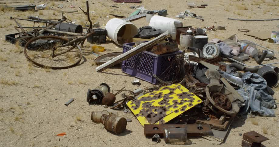 A pile of junk sits on the ground