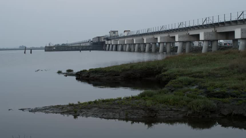 Cement bridge sits over the lake