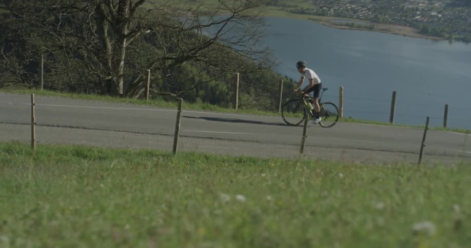 A bicyclist rides up a hill