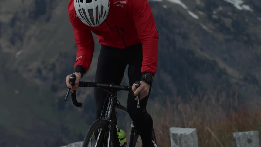 A bicyclist pedals uphill