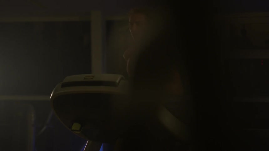 A man jogs on a treadmill