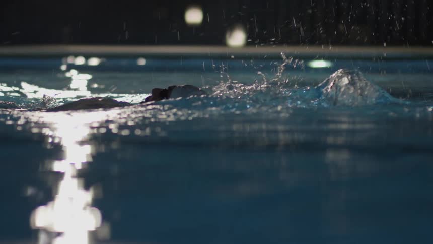 A man swims in a pool