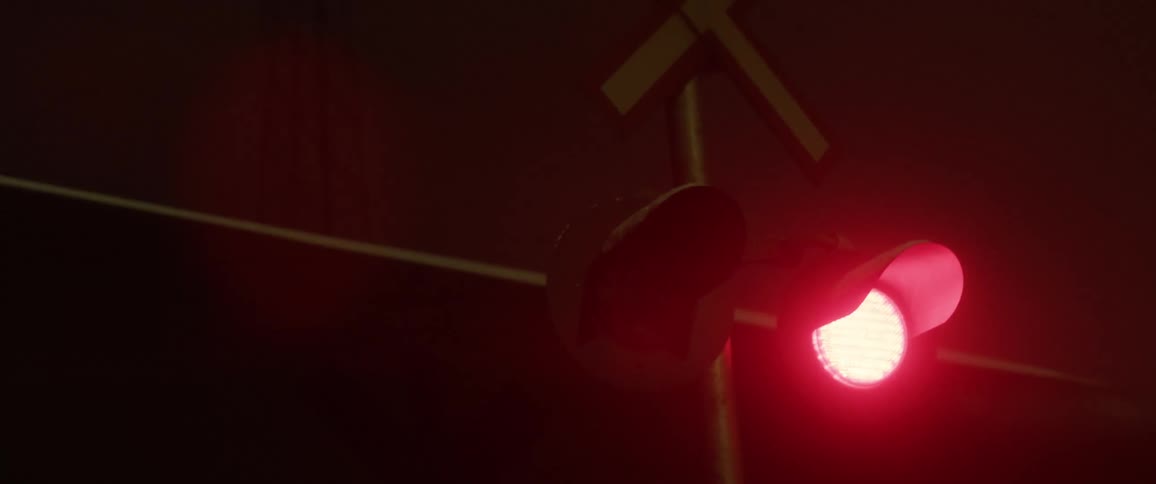 A light blinks in front of a moving train