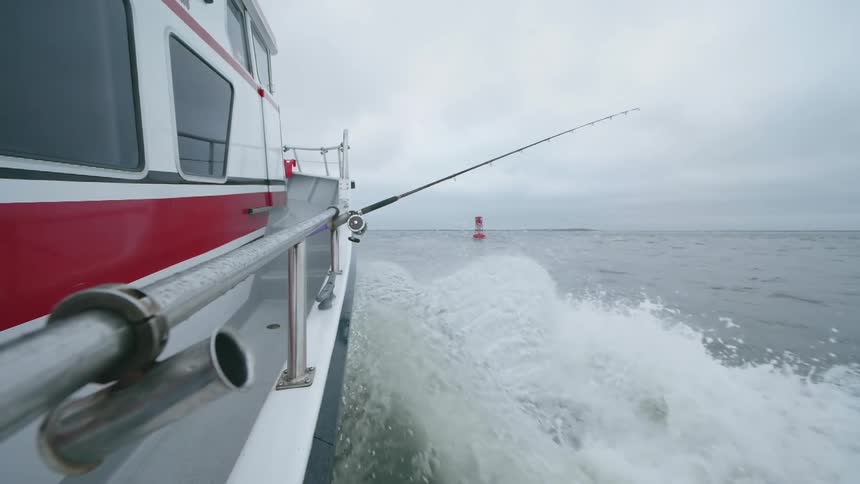A fishing boat travels on the water