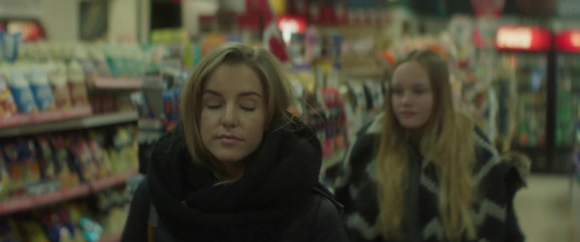 Two women browse the grocery store