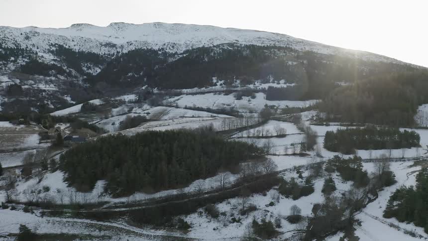 Flying over a snow covered valley
