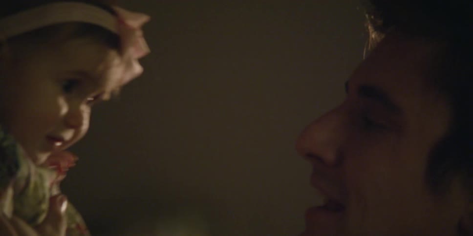 A man is kissing his child