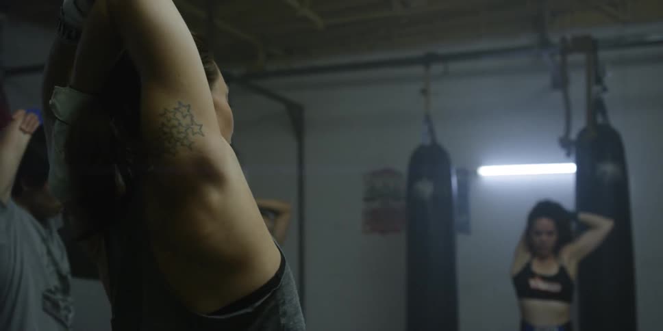 People stretch in a gym