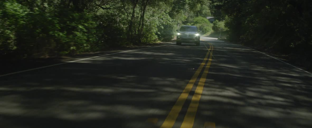 Car drives on a rural road