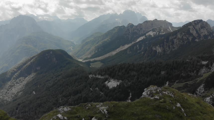Clouds float above mountains in the wilderness