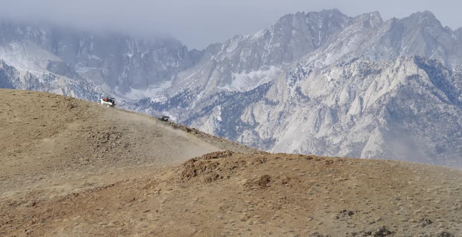 People driving vehicles up the hill of the mountain