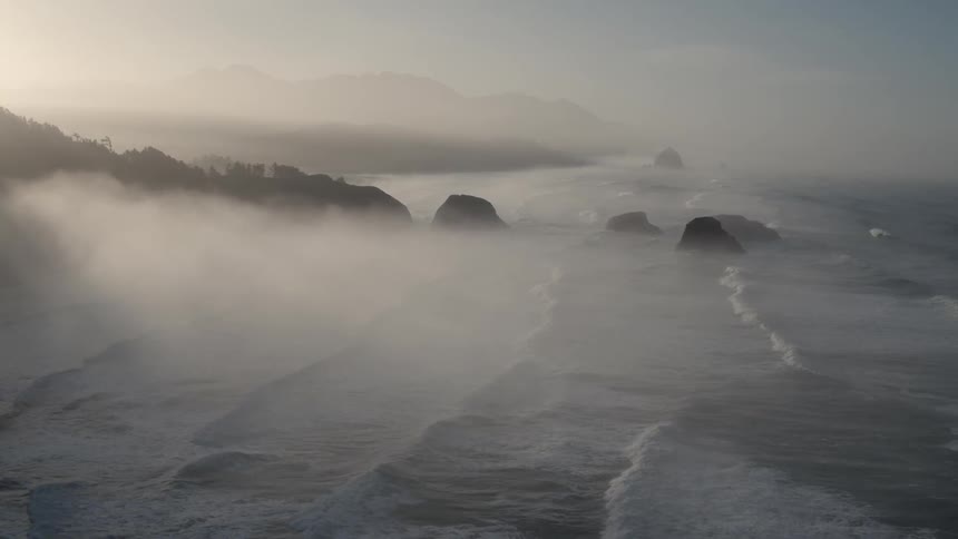 The tide flows onto the beach shore
