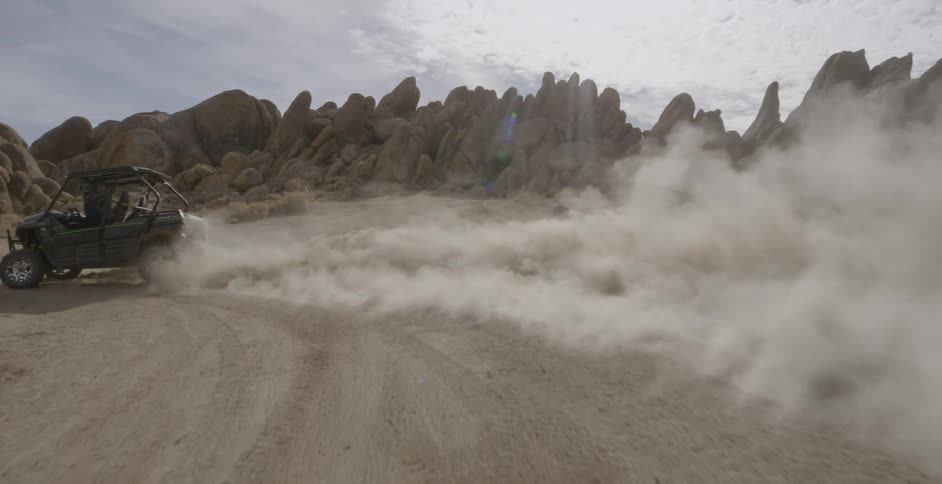 Four wheeler skids across desert floor