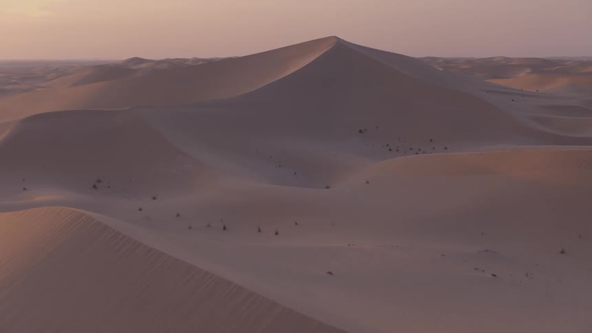View of sand dunes at sunset