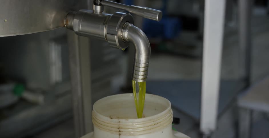 Green liquid pours from a tap