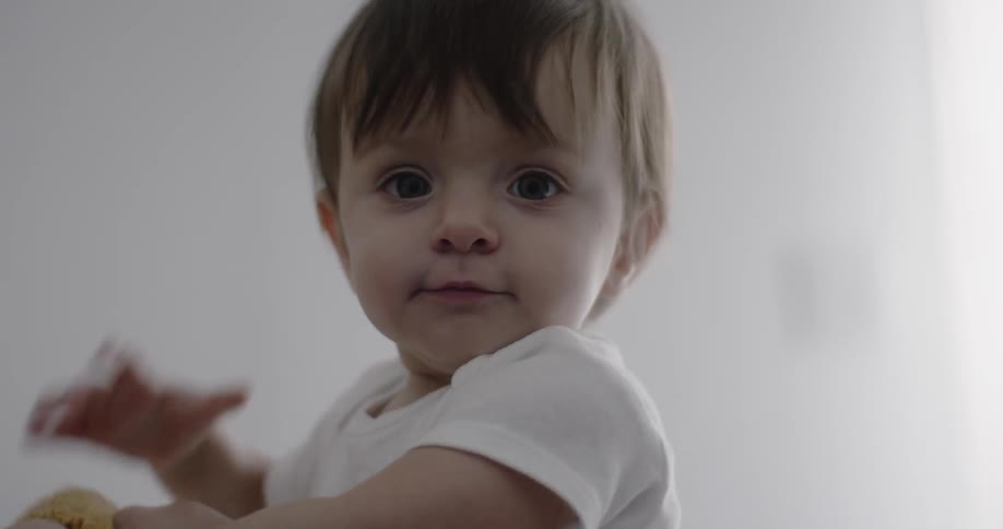 Man lies with baby in bed
